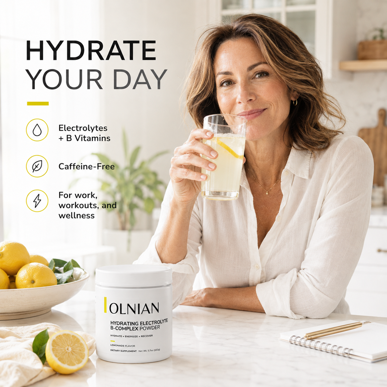 A woman in a white blouse sits at a kitchen table holding a glass of lemonade, with a tub of OLNIAN Hydrating Electrolytes & Complex Powder in front of her. The image includes marketing text on the left highlighting electrolytes, B vitamins, caffeine-free formula, and wellness benefits.