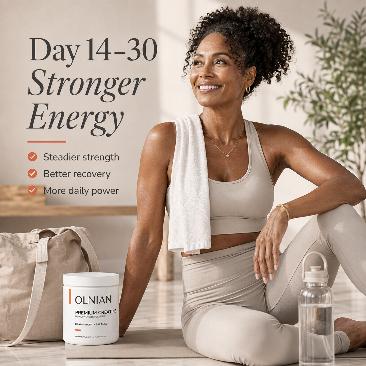 A woman in beige workout clothes sits on a floor beside a white OLNIAN supplement tub, towel, and water bottle in a bright indoor setting. Large text reads 'Day 14-30 Stronger Energy' with bullet points about steadier strength, better recovery, and more daily power.
